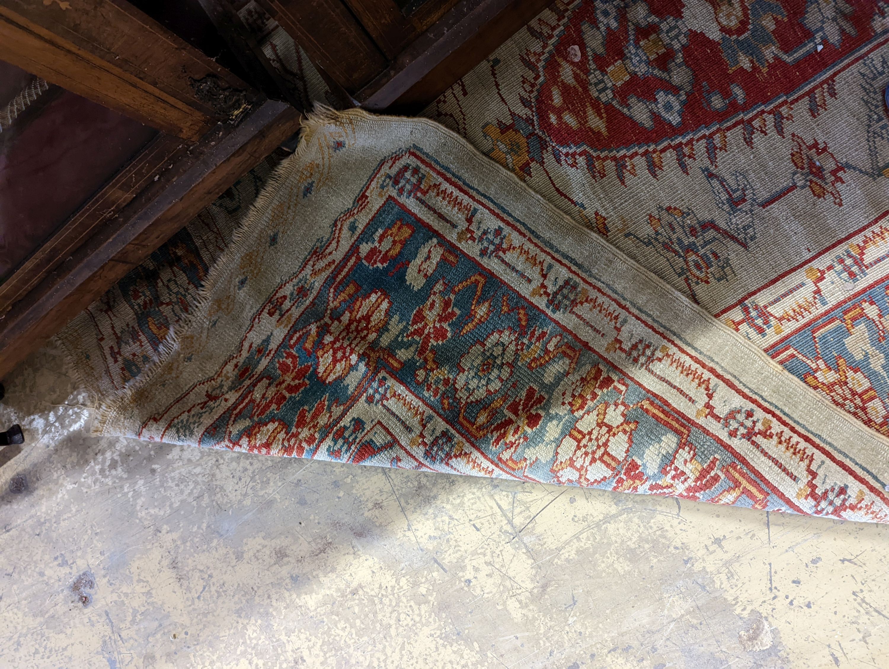 An antique Turkish? ivory ground rug, 218 cm long, 145 cm wide